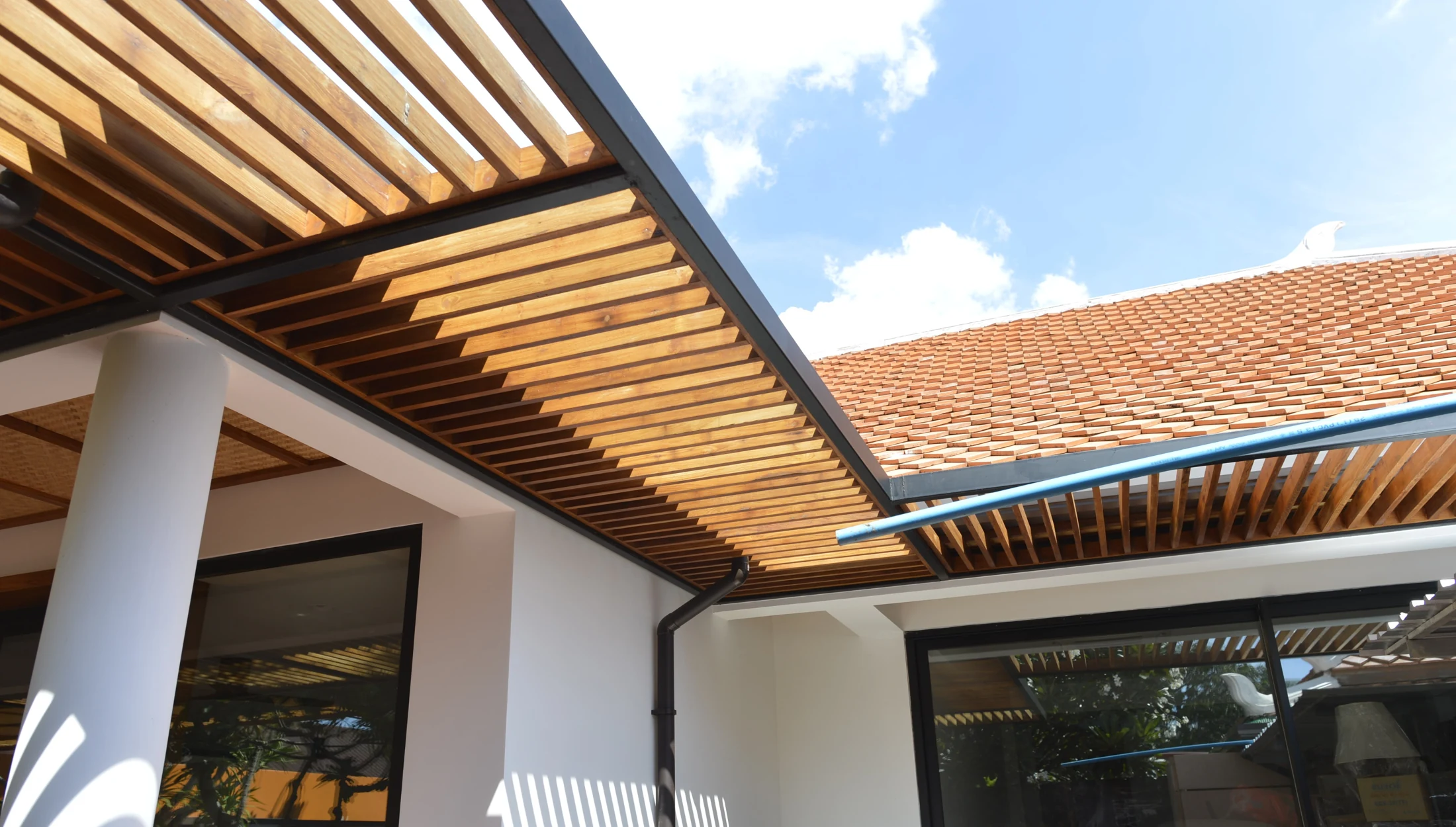 Courtyard exterior and timber shading · renovation-stage photograph